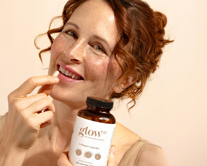 Woman with collagen capsules